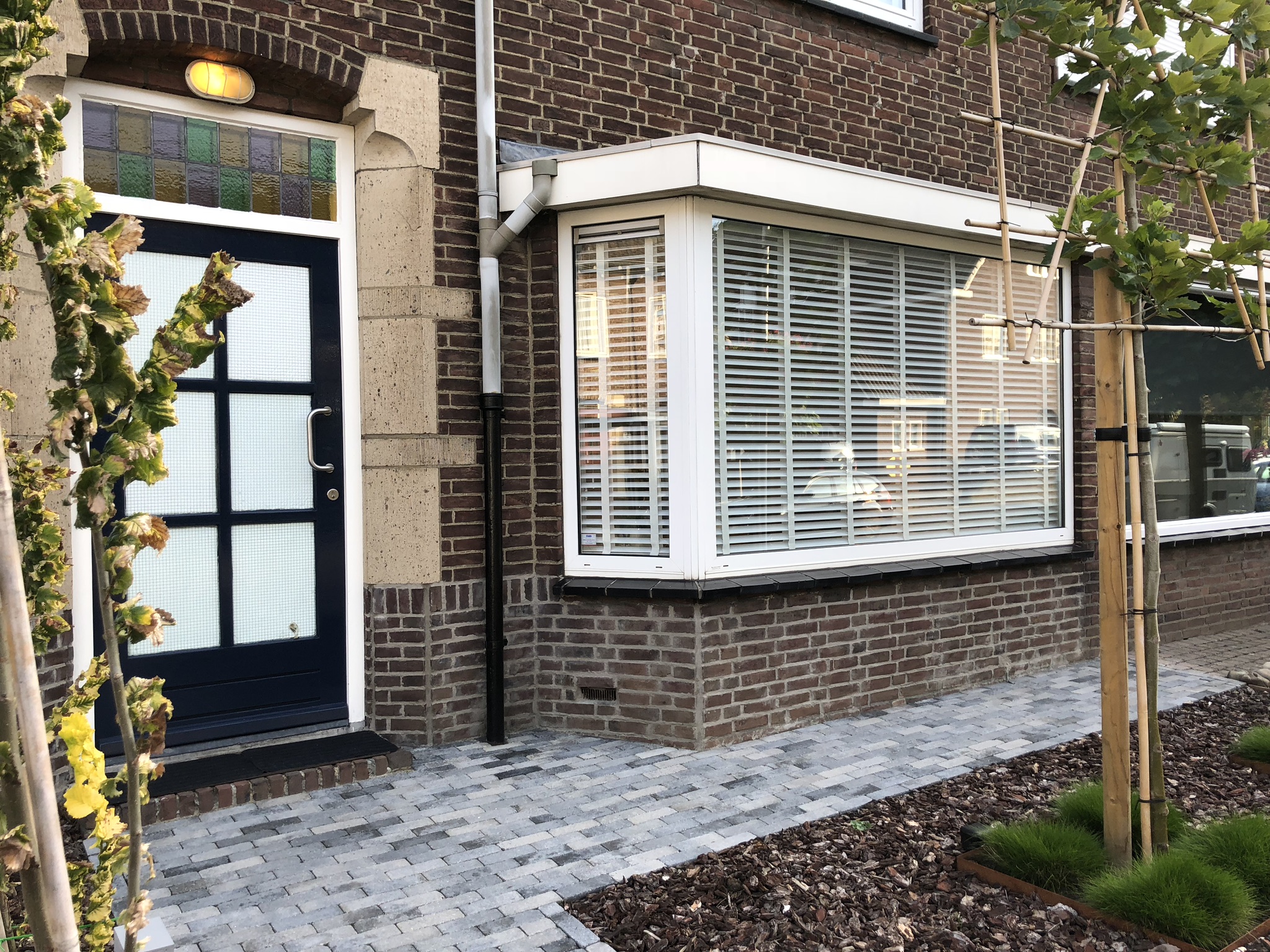 Fraké houten sectionaaldeur met gevelbekleding | Different Doors